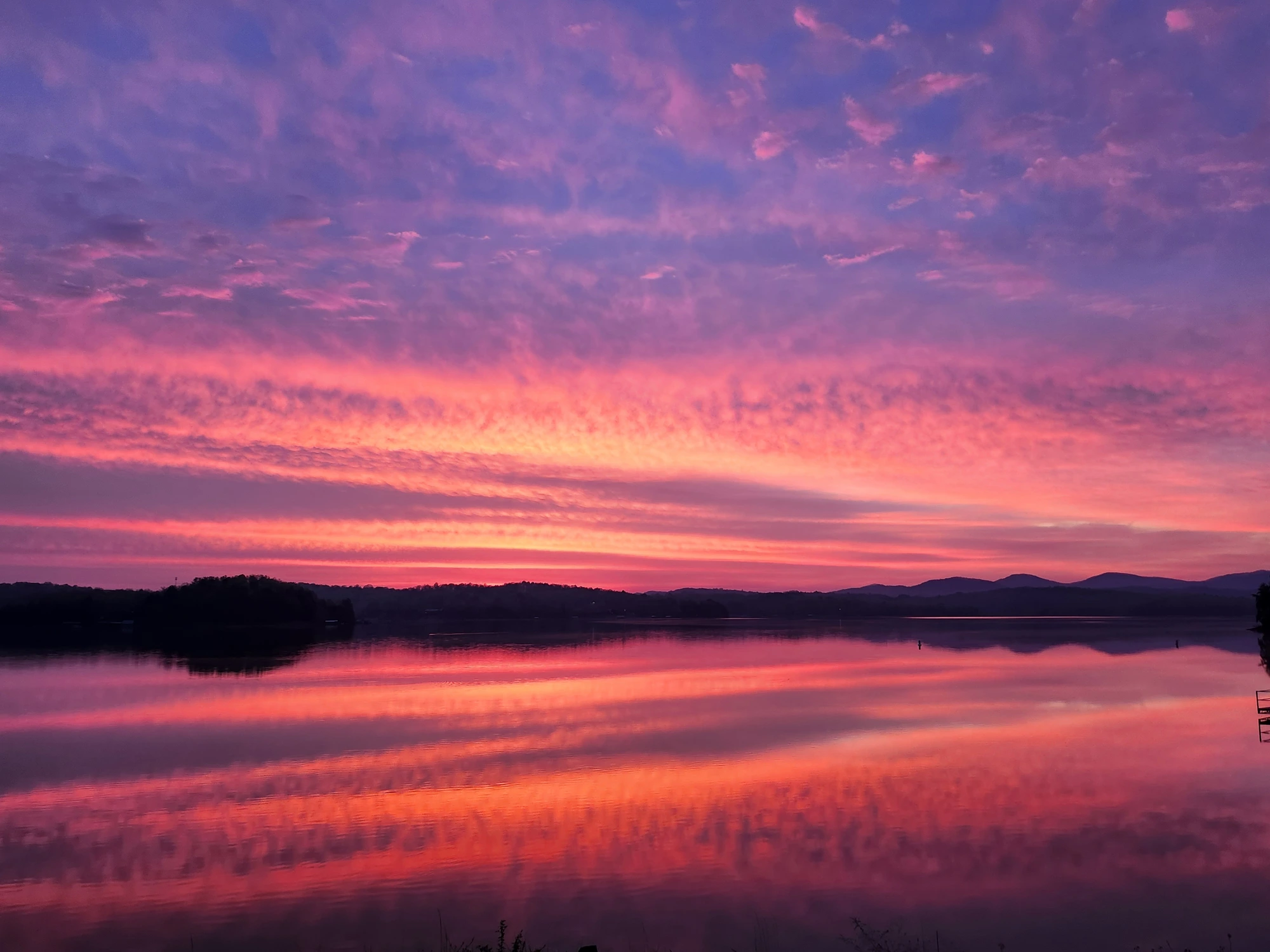 Embers over still water — an evening's peace, held quietly at the close of the day.